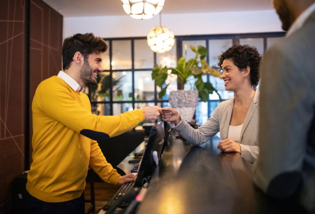Traveler checking in at hotel using a hotel credit card